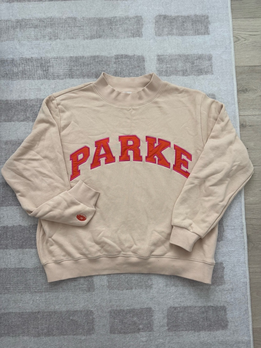 Parker Beige Crewneck Sweatshirt with Red Lettering